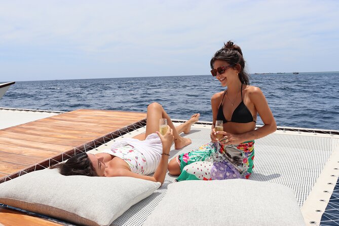 4-in-1 • Gili Islands Snorkel & Sunset Half-day Catamaran Cruise - Onboard fun after snorkeling: floating beach-club style time