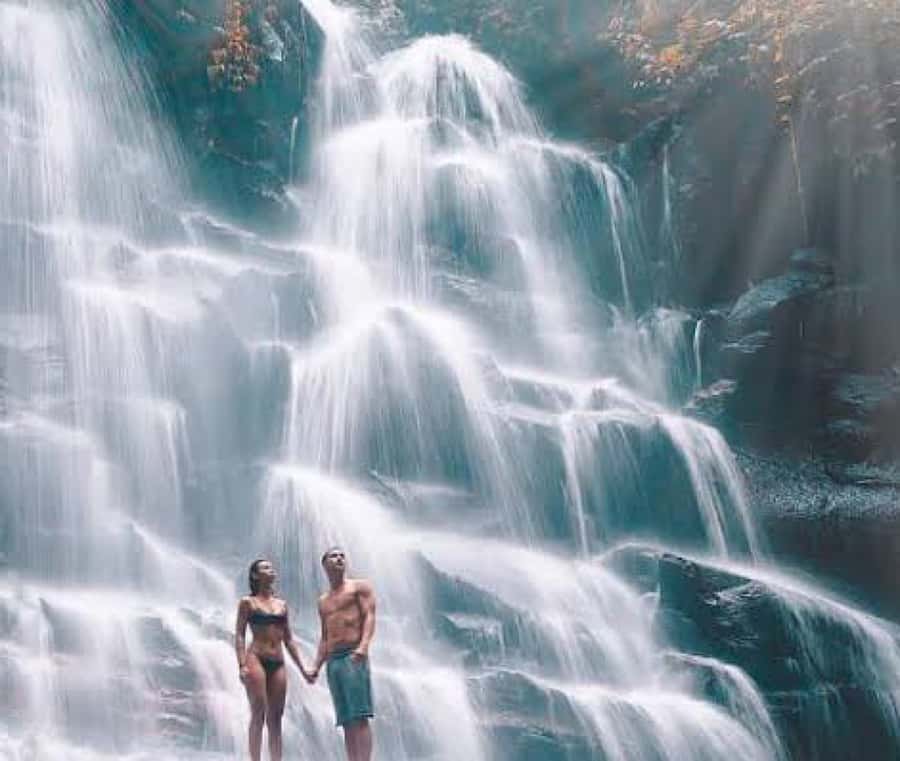 Bali: Blue Lagoon Snorkeling & Waterfall Tour with Lunch - Kanto Lampo Waterfall: a short hike and a very photo-friendly rock