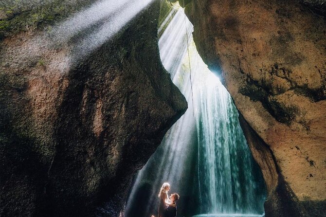 Bali Instagram Tour - Tukad Cepung Waterfall: cave light and careful footing