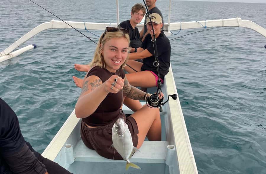 Bali/Lovina: Private Fishing Tour with Snorkeling Option - Catching fish on Lovina’s north coast, in a traditional boat