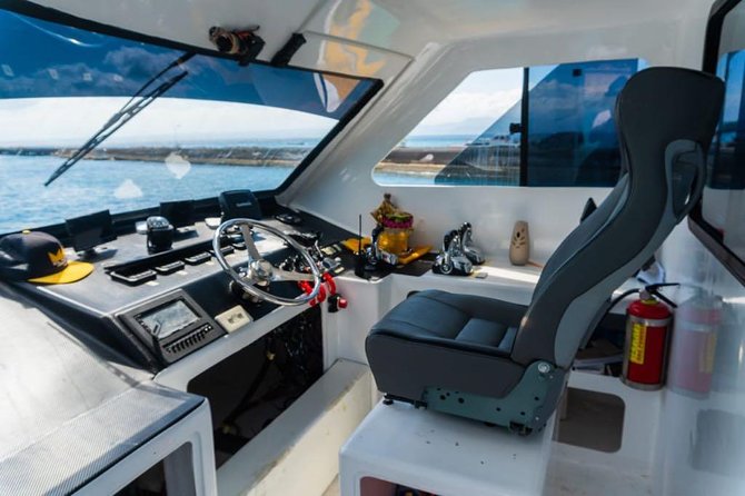 Fast Boat Transfer: Sanur to Nusa Penida by Penidago - The boat itself: Angel Billabong, luggage, and seating reality