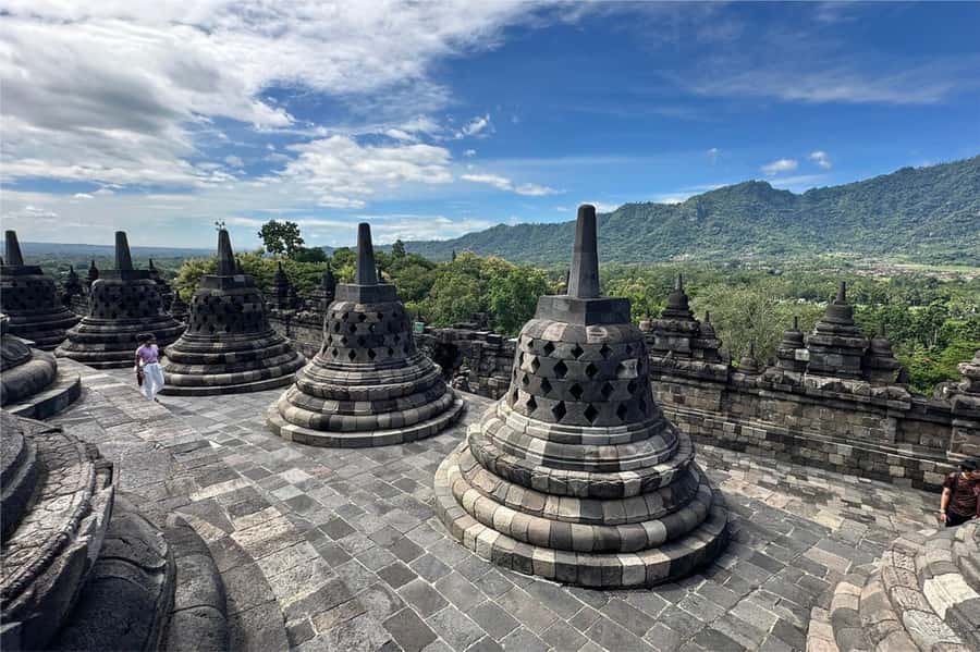 From Yogyakarta: Borobudur Sunrise Half Day Tour with Pickup - Temple climb-up access, steps, slippers, and real-world pacing