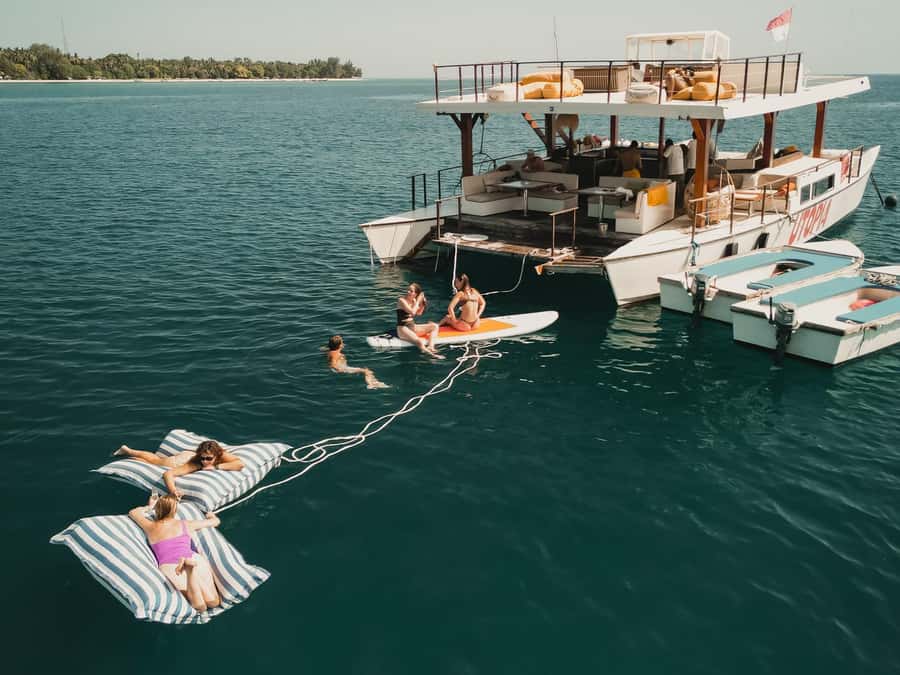 Gili Islands: 4-in-1 Catamaran Snorkeling Experience - Snorkeling stops for turtles and coral, plus gear and a safety guide