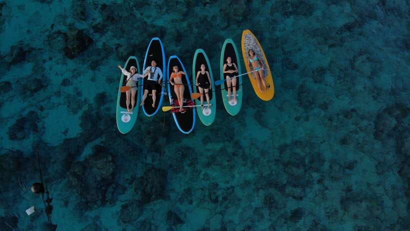 gili sunrise Stand-up paddle boarding or kayaking (droneshot - Turtle Hunting While You Cross the Gilis