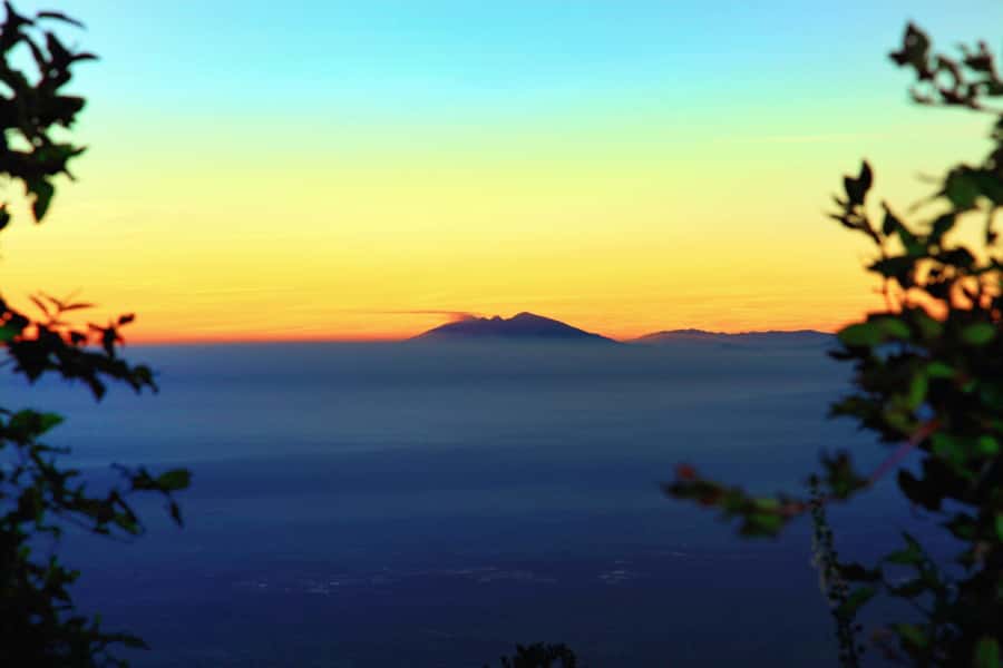 Merapi volcano sunrise with 4wd jeep and step on cold lava - Golden sunrise between the mountains, and how to handle mist