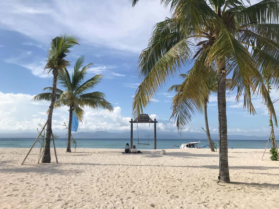 Nusa Lembongan Mangrove & Island Tour - Mahagiri Beach: Long White Sand and Mount Agung in the Background