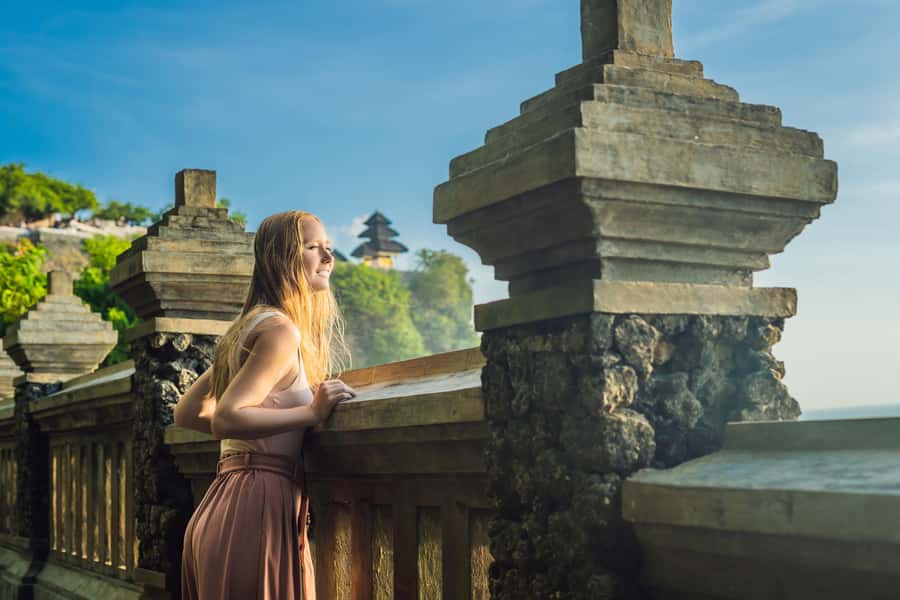 Sunset Temple Tour - Uluwatu Temple in late light: cliff views, sarongs, and crowd control